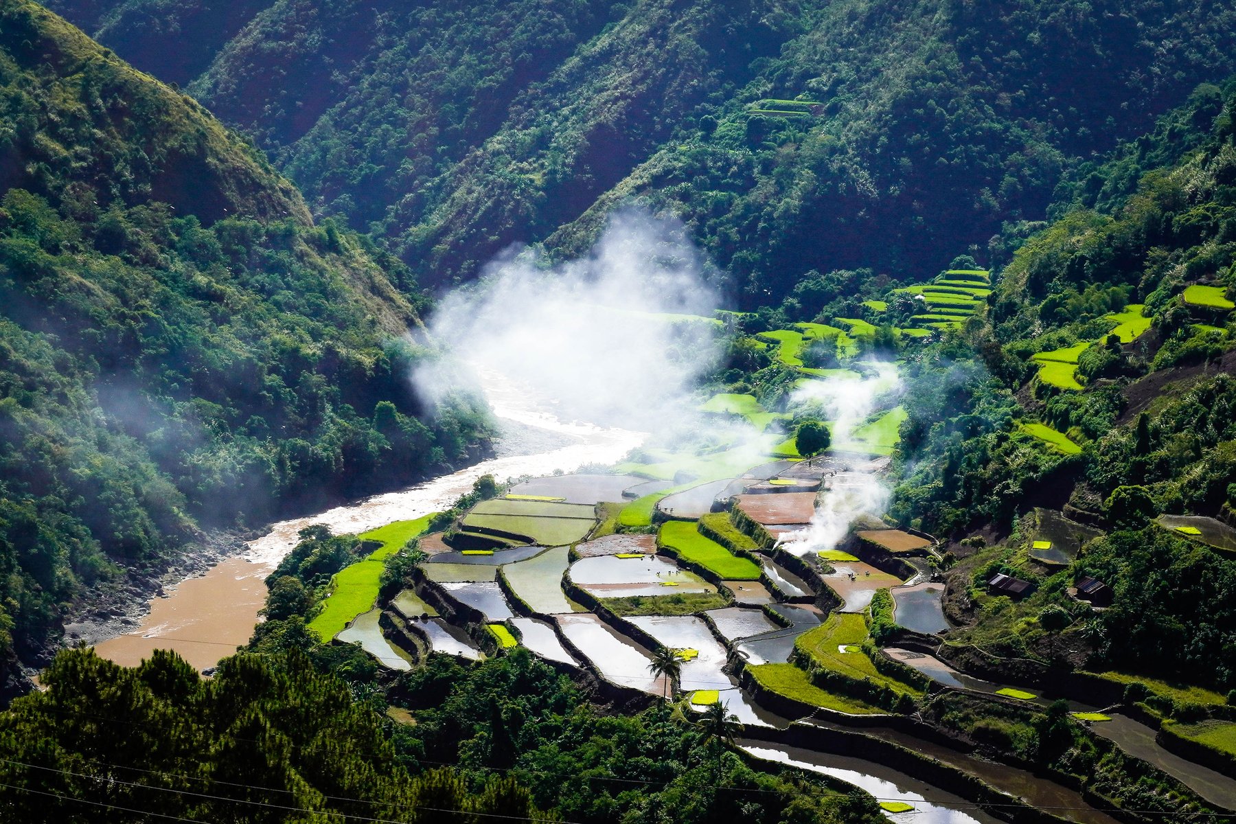 A remote Cordillera valley of rice terraces and river mist, far from any city